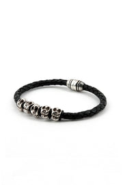 BRAIDED LEATHER BRACELET W/SKULLS